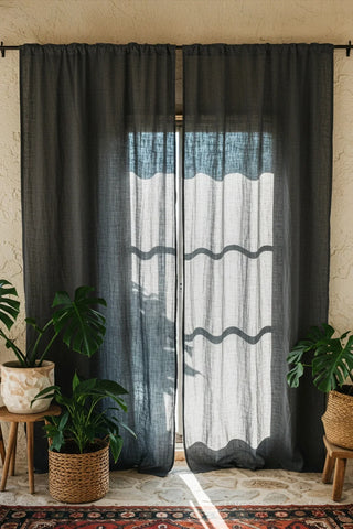 Dark rod pocket sheer panels, sunlit window. Handwoven 2-layer muslin cotton curtain, Denizli, OEKO-TEX. Vivamaison.