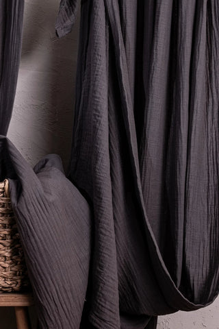 Gray fabric folds closeup with basket edge. Handwoven 2-layer muslin cotton curtain, Denizli, OEKO-TEX. Vivamaison.