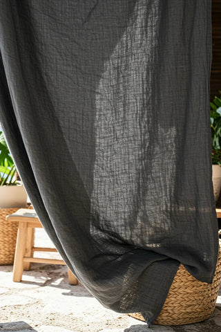 Backlit gray gauze texture closeup outdoors. Handwoven 2-layer muslin cotton curtain, Denizli, OEKO-TEX. Vivamaison.