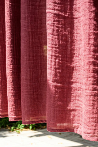 Sunlit muslin texture close-up outdoors. Handwoven 2-layer muslin cotton curtain, Denizli, OEKO-TEX. Vivamaison.